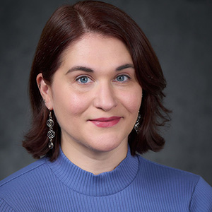 woman in blue shirt with a smile