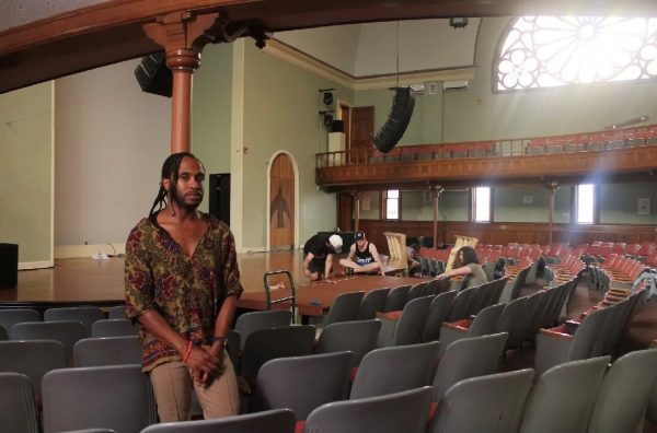 Man is pictured in an auditorium