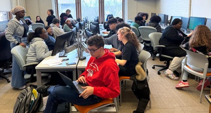 Students in a computer lab work on poster projects for the American Statistical Association contest. Their visit was hosted by Professor Jonnell Robinson in Lyman Hall.