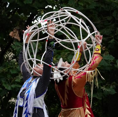Two people perform a Native American Loop Dance