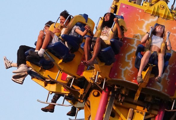 People on a midway ride at the New York State Fair