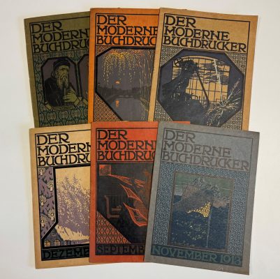 Three vintage German art magazines titled "Der Moderne Buchdrucker" (The Modern Printer) from different months - December, September, and November 1918 - featuring Art Nouveau-style covers with decorative typography and illustrations including winter scenes, geometric patterns, and nature motifs.