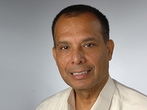 person smiles and looks into camera