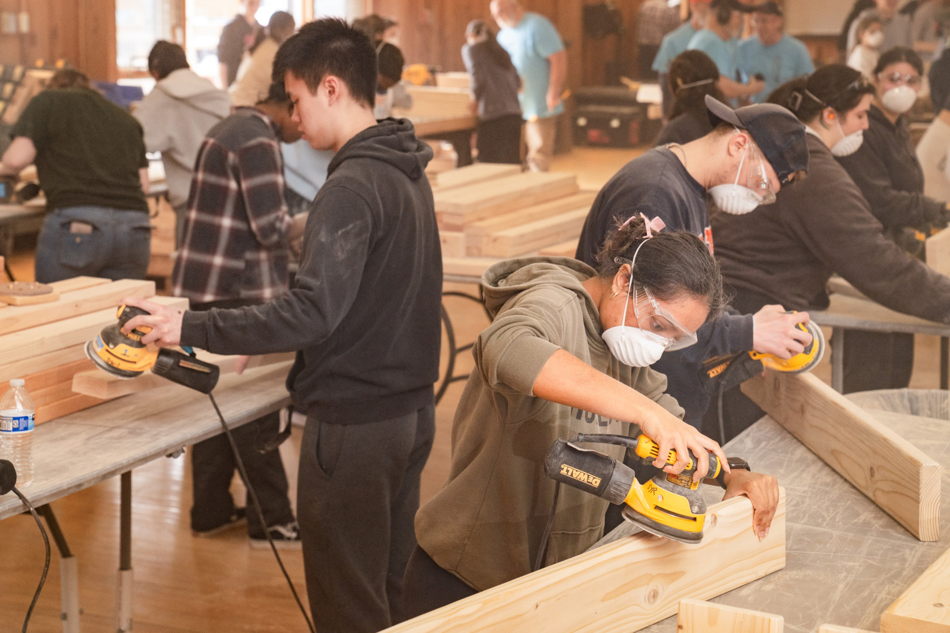 Students work on building beds for the local chapter of Sleep in Heavenly Peace. The project was done through the Syracuse University volunteer organization.