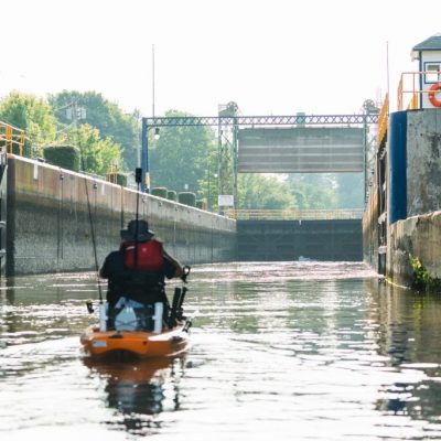 A kayaker paddles through the canal at Lock 24 in Baldwinsville