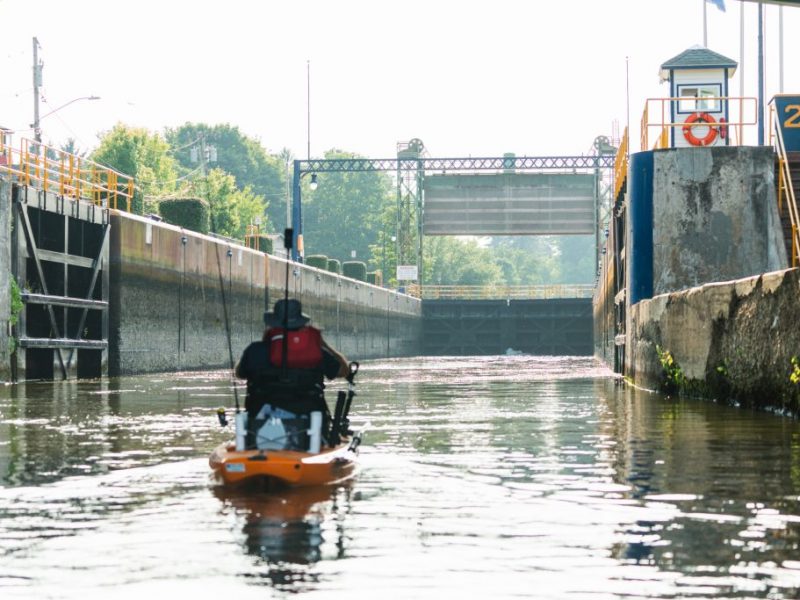 A kayaker paddles through the canal at Lock 24 in Baldwinsville