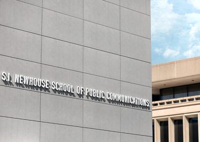 Exteriors of Newhouse buildings with S.I. Newhouse School of Public Communications on the front wall