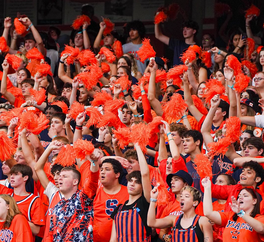 Students cheer on the Syracuse University football team in the JMA Wireless Dome.