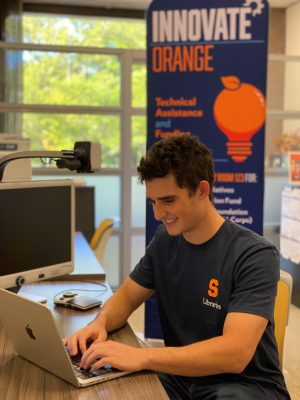 Sawyer Tardie ’27 (Martin J. Whitman School of Management), Vice President of the E-Club, works with Orange Innovation Fund startups in SU Libraries.