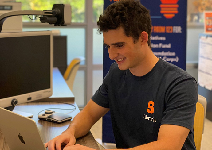 Sawyer Tardie ’27 (Martin J. Whitman School of Management), Vice President of the E-Club, works with Orange Innovation Fund startups in SU Libraries.