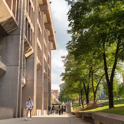 Exterior view of Bird Library with students walking by
