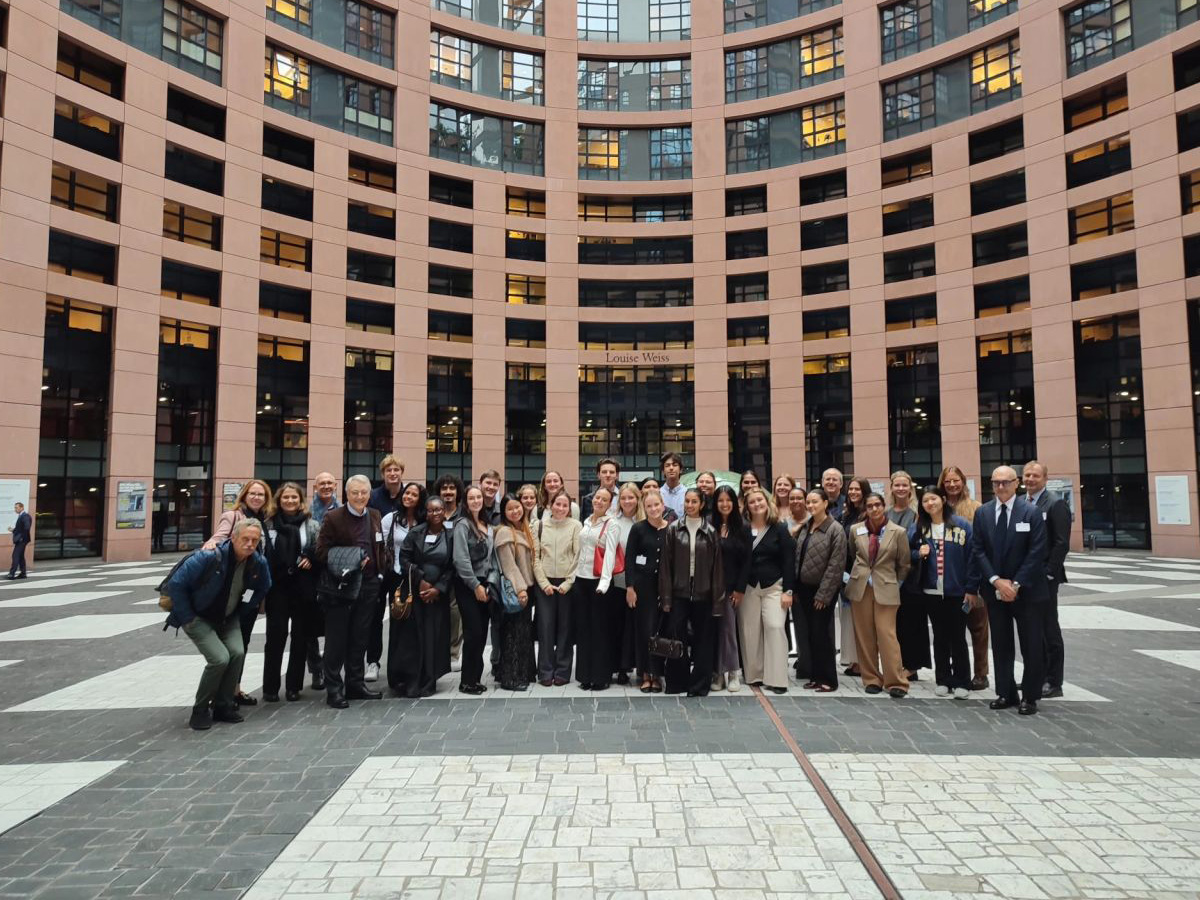 Abroad students and directors pictured outside of Parliament