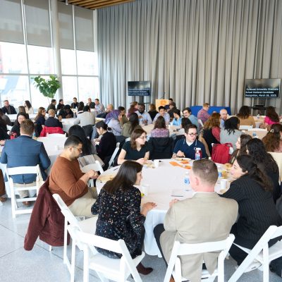 groups of people seated at various tables