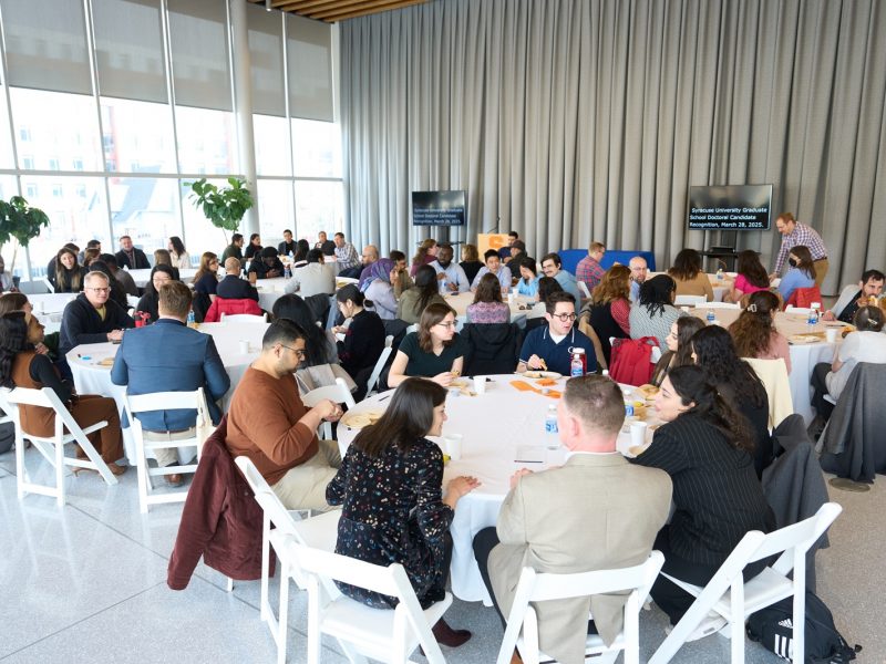 groups of people seated at various tables