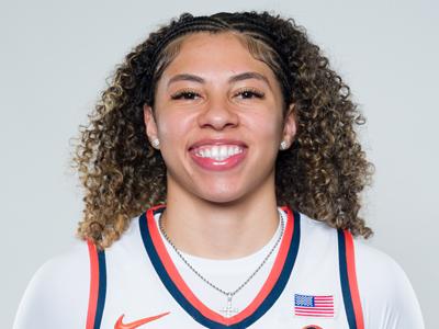 A person smiles while wearing their white Syracuse women's basketball jersey.