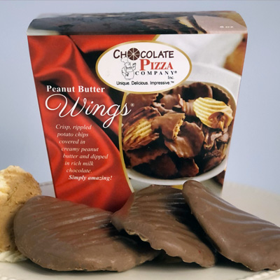 Box of Chocolate Pizza Company Peanut Butter Wings with chocolate-covered rippled potato chips displayed in front, alongside a scoop of peanut butter
