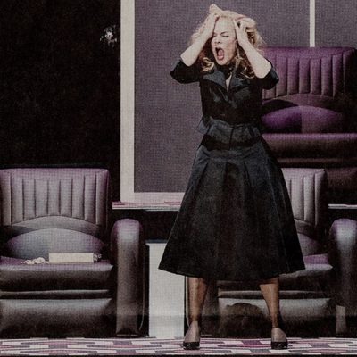 Woman standing grabbing her hair with a look of frustration, chairs in the background