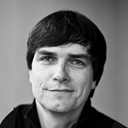 Black and white photo of man smiling