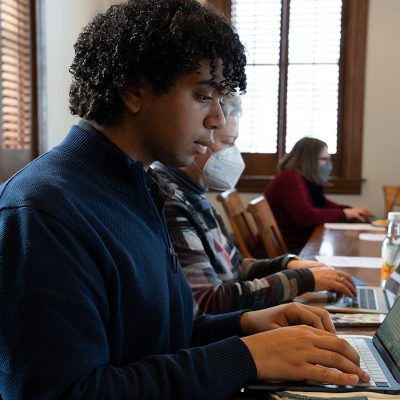 Student types on a laptop