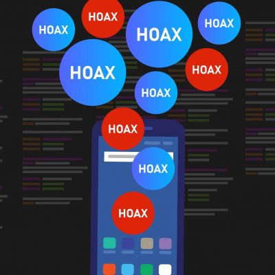photo of a mobile phone with blue and red bubbles that say "hoax" floating above it on a black background.