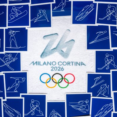 Milano Cortina 2026 Winter Olympics logo surrounded by winter sports illustrations.