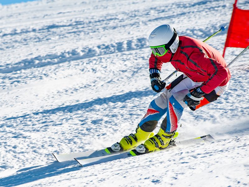 person skiing down a snow-covered hill
