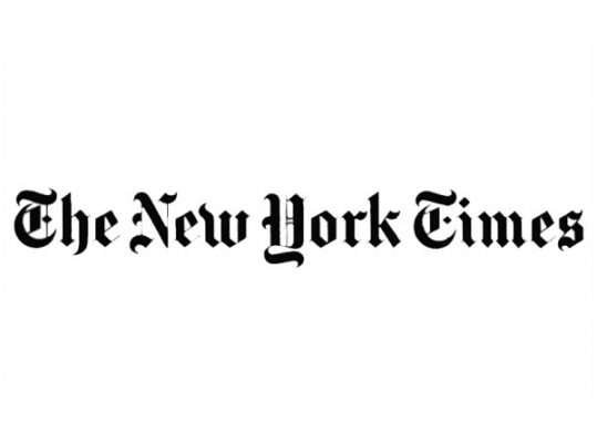 The New York Times logo in black in front of a white backdrop.