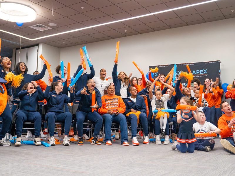 Members of a women's basketball team react to the news they made the NCAA tournament.