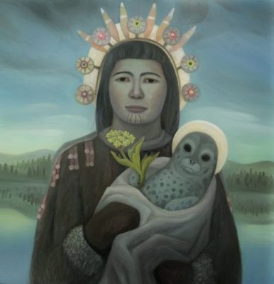 A painting of an Indigenous woman depicted in a Madonna-like pose, holding a baby seal with a halo in place of a child. She wears traditional facial tattoos and an ornate headdress of feathers and decorative flowers. She holds a small yellow flowering plant and is dressed in dark robes with beaded details. A misty landscape with water and trees appears in the background.