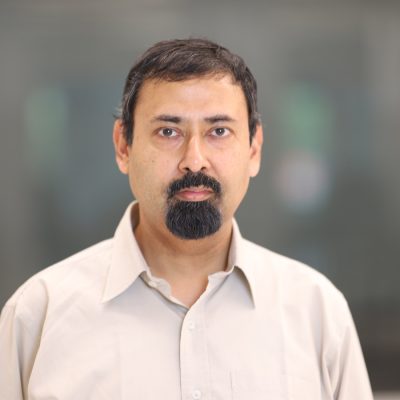 Headshot of Amit Sanyal, professor of mechanical and aerospace engineering, wearing a light beige button-down shirt.