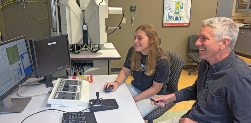 Student Emerson Long worked with faculty member Jay Thomas, including on experiments using a scanning electron microscope at a University lab.