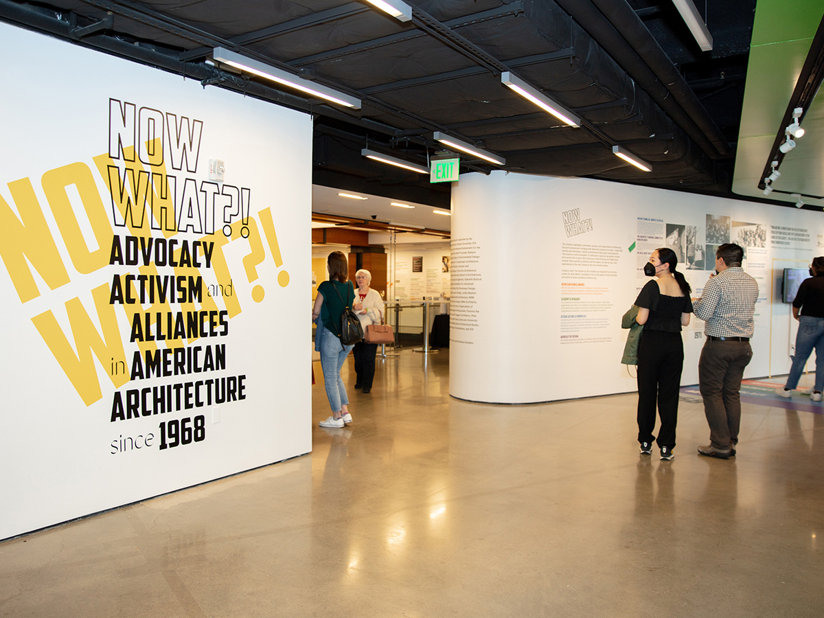 Interior view of an architecture exhibition with visitors