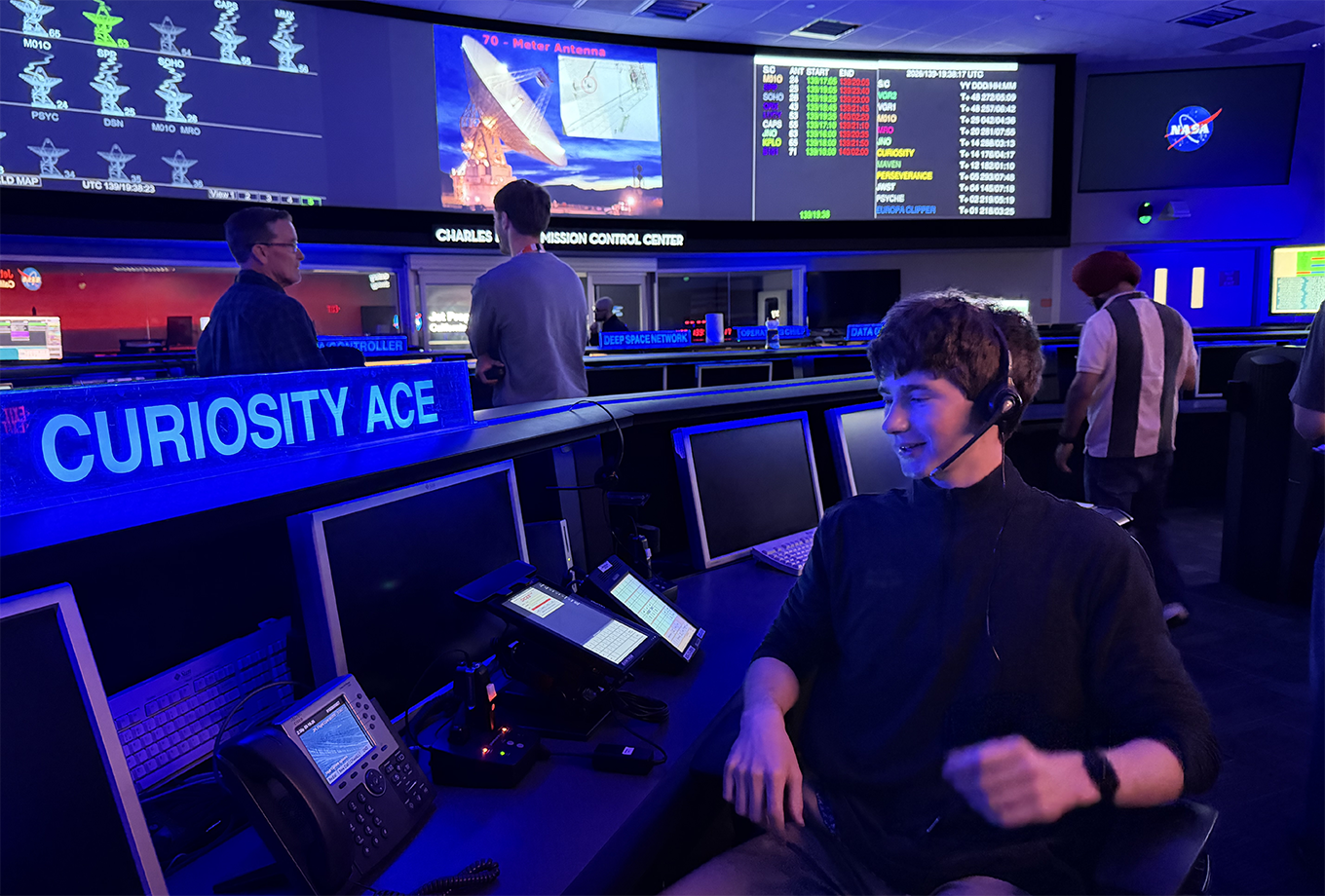 A person seated at Curiosity Ace console in mission control