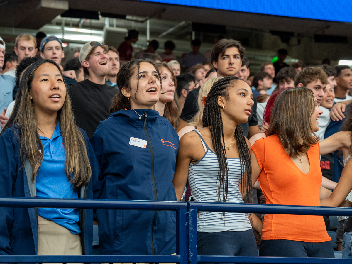 Students sing along during New Student Convocation in the JMA Dome.