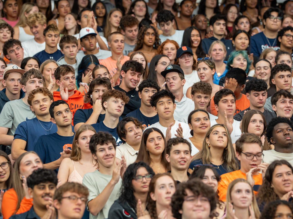 Crowd of students applauds during Syracuse University's New Student Convocation.
