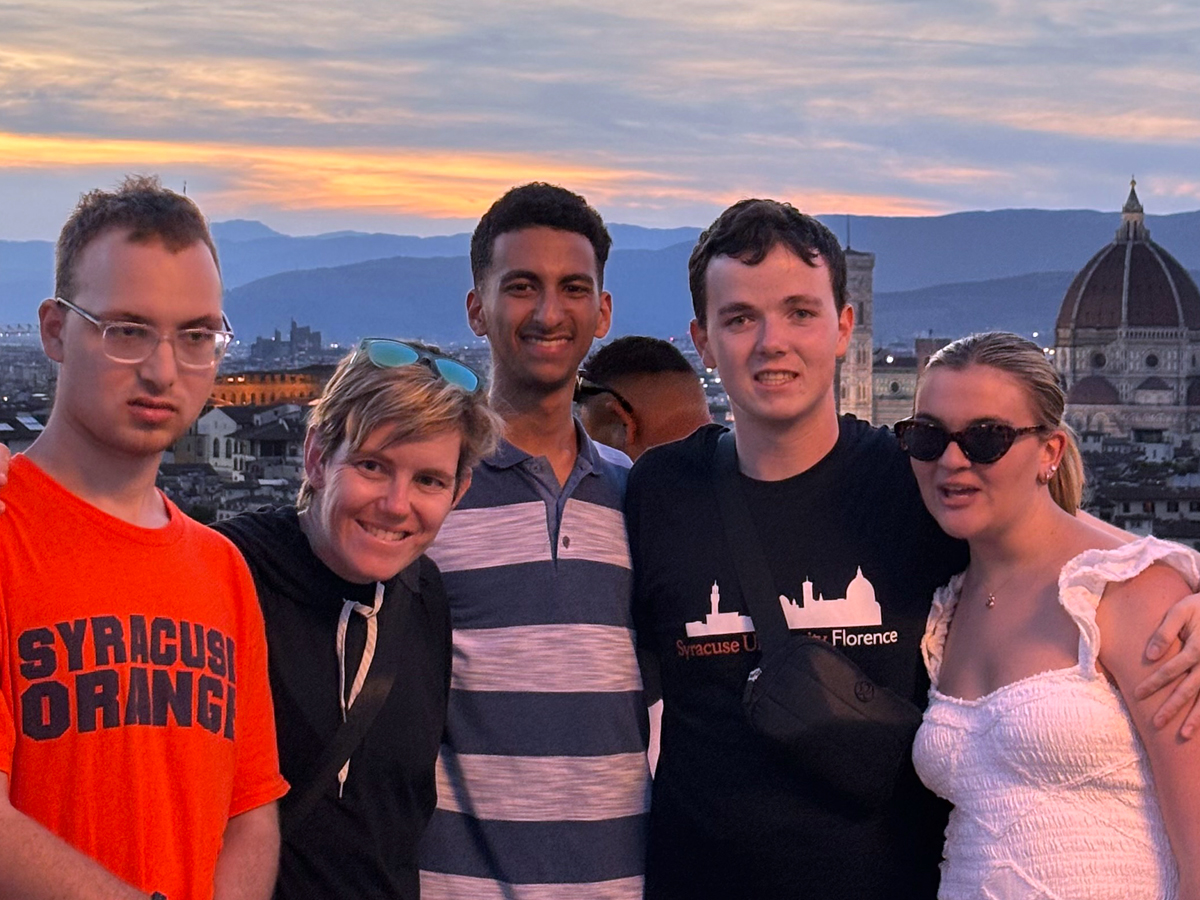 Elyas Layachi with four friends at sunset overlooking Florence, Italy