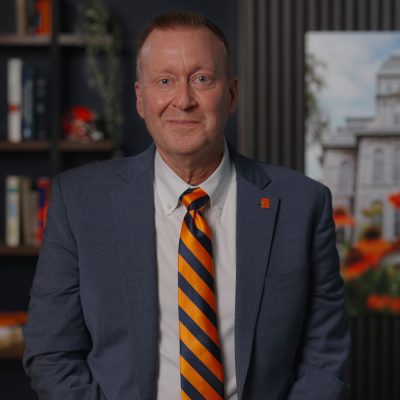 Chancellor speaking in a video message from his office