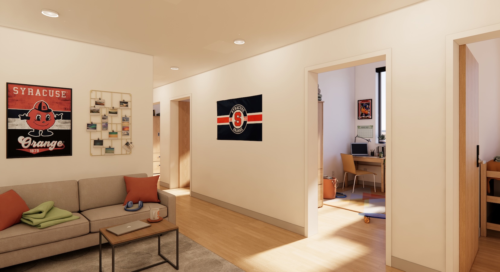 Residence hall suite common area with sofa seating, Syracuse University décor, and private bedrooms opening off a shared living space.