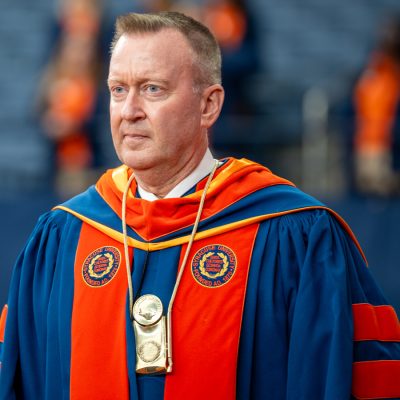 Chancellor Haynie wears Syracuse University academic regalia and a ceremonial medallion.