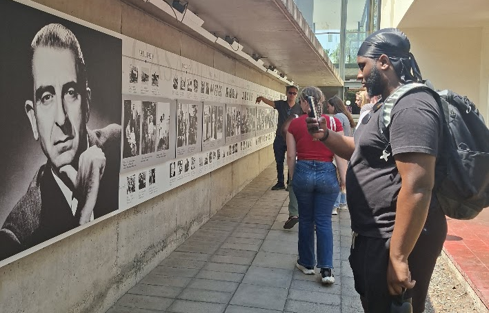 Students walking around Buenos Aires analyzing monuments and urban design related to human rights and Latin American identity while an on-site class led by Mauricio.